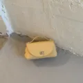 Stylish solid color leather shoulder bag with top handle and metal lock for women daily wear. - No Pendant / Yellow