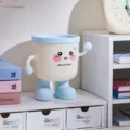 Cute desktop mini trash can with lid and cartoon arms legs, perfect for office desk storage. - No Lid / Blue