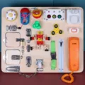 Montessori wooden busy board for toddlers, 21-in-1 sensory development toy with locks, switches. - 21-in-1 Busy Board