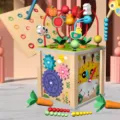 Wooden 10-in-1 activity cube toy with bead maze, shape matching, gears and clock for kids. - 10-in-1