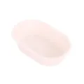 Piccolo stampo da forno in silicone ovale per muffin e dolci in colore rosa chiaro. - Bianco