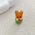Close-up detail of cute 3d glass rabbit bead, orange and green color, perfect for diy handmade jewelry. - Rabbit