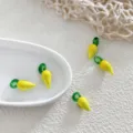 Glass fruit charm beads detail shot, yellow and green DIY jewelry making accessories necklace. - Lemon