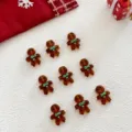 Detailed view of Christmas gingerbread glass charms, perfect for DIY holiday crafts and jewelry. - Gingerbread Man