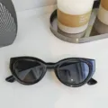 Trendy black cat eye sunglasses for women and men, stylish small frame eyewear for daily wear. - Black