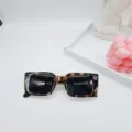 Detailed shot of trendy retro square sunglasses with chic tortoise shell frame and black lenses. - Tortoise Grey