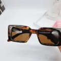 Detailed view of trendy retro tortoise shell square sunglasses with bold thick frames for women. - Tortoiseshell / Tea Lens