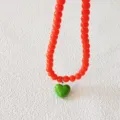 Rote Perlenkette mit grünem Herz-Anhänger, modische süße Schlüsselbeinkette Variante Stil - Orange