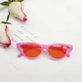 Retro pink cat eye sunglasses with vibrant orange lenses, trendy cutout street style. - Jelly Rose Red with Orange Slices