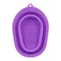 Purple foldable silicone makeup brush cleaning pad with textured surface and hanging hole. - Purple