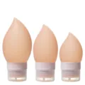 Portable silicone travel bottles set, squeeze dispensers for shampoo, lotion, and liquid soap. - 38ml / Light Orange