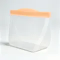Translucent frosted silicone food storage bag with orange sealing bar for kitchen use. - 242x142x79mm / Peach