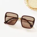 Brown square sunglasses detail featuring gradient lenses and chic metal bridge accent. - Brown