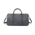 Sac Boston gris en suède avec double poignée et bandoulière pour un usage quotidien. - Gris Chaud