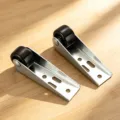 Detail shot of metal door support wheel bracket with durable black roller for sliding doors. - Standard Type