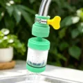 Close-up detail of faucet water filter, green and white splash-proof nozzle with valve. - Rotating PP Cotton Filter Model / Green