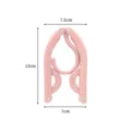 Portable foldable clothes hanger for travel, outdoor, and student dorm use in pink color. - Pink