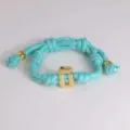 Turquoise woven cord bracelet with gold geometric clasp stylish fashion jewelry accessory