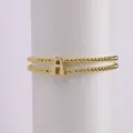Gold plated double layer beaded elastic bracelet with cute puffy letter A charm for women. - Letter A