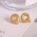 Elegant gold letter Q stud earrings micro paved with sparkling cubic zirconia for women. - Letter Q