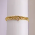 Charming double layer gold plated bead bracelet featuring sparkling letter L pendant variant. - L