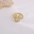 Fashion copper micro-pavé zircon letter ring with 18K gold plating, elegant jewelry design. - Letter U