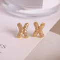 Letter X micro-set zircon gold stud earrings, high-end fashion jewelry for women. - Letter X