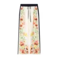 Close-up view of vintage floral print trousers with dark blue side stripes and drawstring waist. - XS / Bottoms / Printing