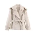 Chic beige short trench coat for women with lapel and belt. Ideal for spring work. - S / Off White