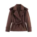 Detail view of the brown short trench coat featuring classic lapels and a chic belt. - Coffee