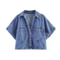 Gedetailleerd overzicht van het mooie vintage denim shirt met V-hals en handige borstzakken. - XS / Tops / Middelblauw Bovenstuk
