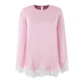 Detailed view of the pink satin long sleeve top with elegant white lace trim at cuffs and hem. - S / Pink