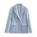 Close-up detail of the blue houndstooth tweed fabric, elegant lapel and metal buttons. - XS / Tops