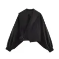 Black cropped jacket detail, featuring an oversized shawl collar and elegant lantern sleeves. - S / Black