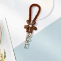Cordon lanière de téléphone fleur en cuir peluche marron avec fermoirs métalliques. - B Brun