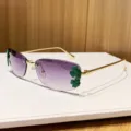 Lunettes de soleil sans monture pour femmes avec élégant décor de trèfle vert et dégradé. - Gris Dégradé