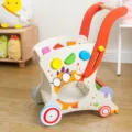 Wooden baby walker and toy storage cart with shape sorting blocks for toddlers. - Wooden Walker