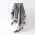 Detailed view of women's 88cm satin square scarf with elegant black and white paisley floral print. - 88x88cm / White