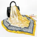 Women silk feel square scarf with classic paisley print and elegant baroque border design. - Egg Yellow