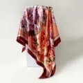 Detailed view of vintage satin floral square scarf, smooth fabric texture and draped style. - D9508 - Red