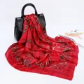 Detailed view of the red paisley satin square scarf featuring intricate vintage teardrop patterns. - D9065-Red