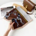 Detail of luxury square silk scarf with classic chain and equestrian motifs in chic retro color. - RZ6529 - Coffee