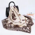 Detailed view of luxury brown leopard and golden chain print silk square scarf, smooth satin. - D9189-Beige Apricot