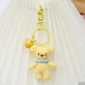 Handmade crochet bear keychain detail shot with yellow wool and cute blue scarf ornament. - Dog Head Buckle Bear / Yellow