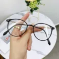 Round optical glasses frame for women in classic black with elegant gold metal details - Bright Black Gold
