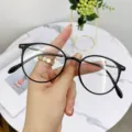 Lightweight round eyeglass frames for women, stylish black frame with metal temples. - Matte Black Silver