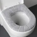 Verdichteter plüschgrauer O-förmiger Toilettensitzbezug, weiches warmes Badezimmerkissen. - Grau