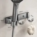 Adjustable wall-mounted shower head holder with multi-functional hooks for bathroom use. - Gunmetal Shower Bracket - Double Hook