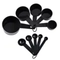 Black plastic measuring cups and spoons set with clear capacity markings for baking use. - 10-Piece Set / Black