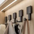 Modern black wall-mounted coat hooks for entryway wardrobe and hallway home organization. - Pack of 5 / Black & Gold